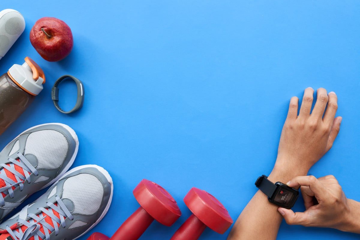 fitness-equipment-with-smart-watch-on-blue-backgro-2026-01-07-06-58-33-utc